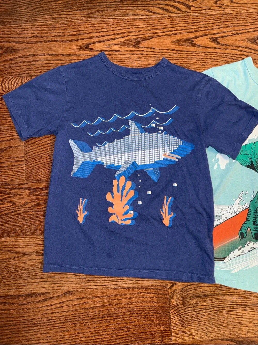 Size M/7-8 boys bundle of 2 short sleeve graphic t-shirts.